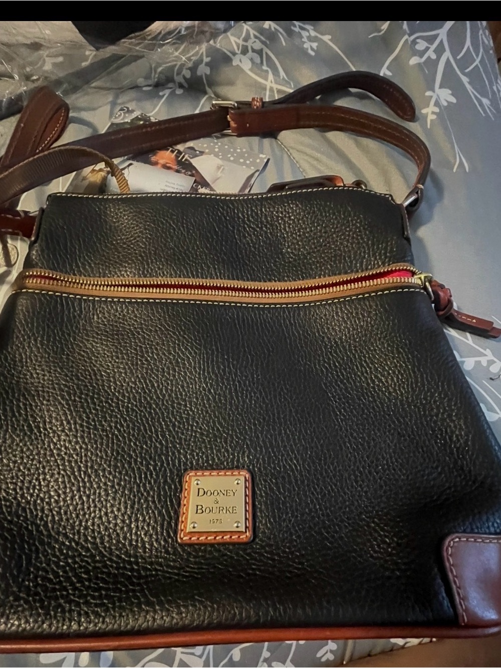 Dooney & Bourke Black Leather Pouch with Brown Trim and Red Interior like new